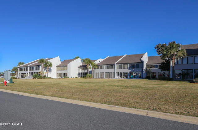 exterior space featuring a yard and a residential view