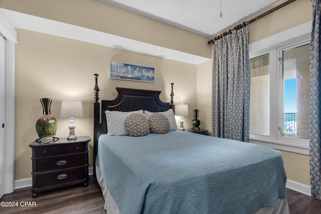 bedroom featuring dark wood-type flooring