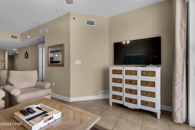 tiled living room with ceiling fan