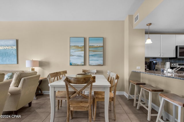 dining space with light tile patterned flooring