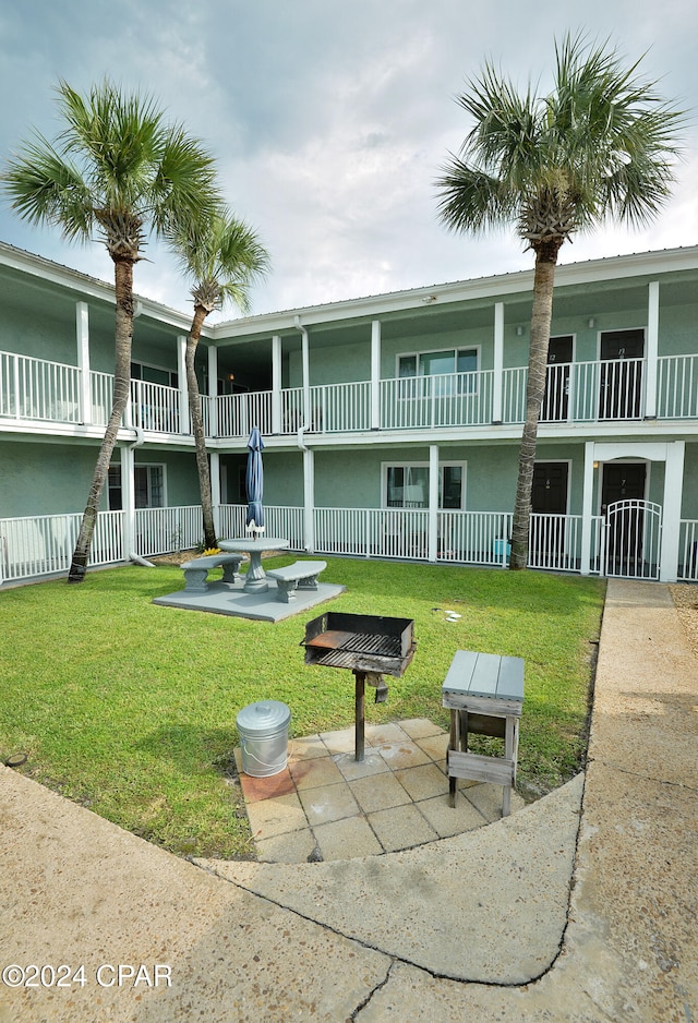 view of property's community with a lawn