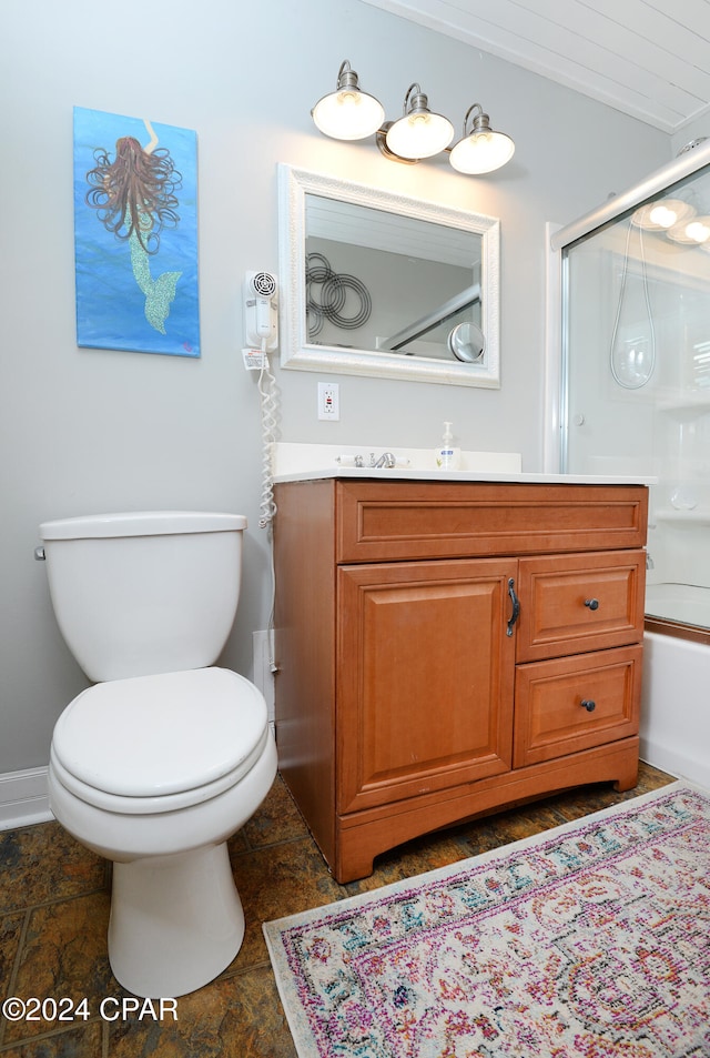 full bathroom featuring toilet, combined bath / shower with glass door, and vanity