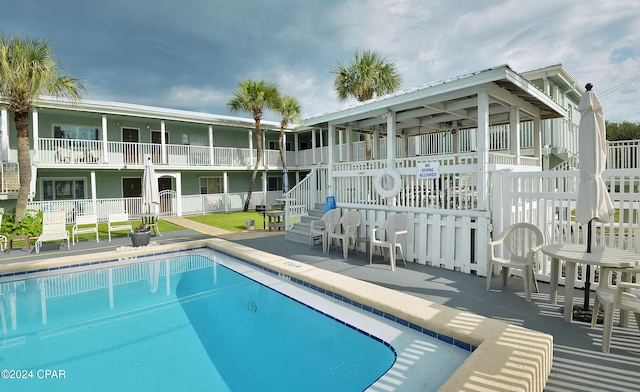 view of swimming pool featuring a patio area