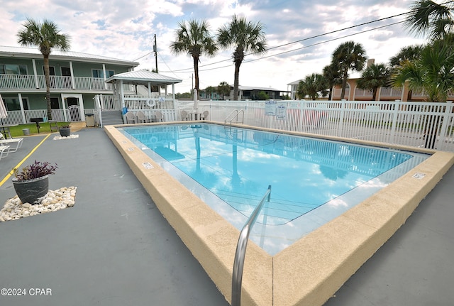 view of pool featuring a patio area