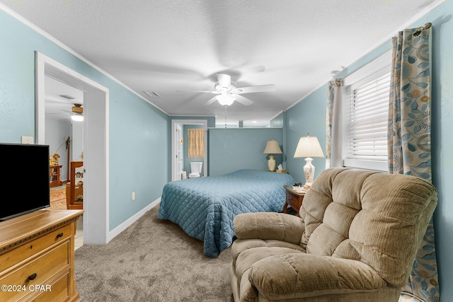 bedroom featuring crown molding, ceiling fan, a textured ceiling, connected bathroom, and light colored carpet