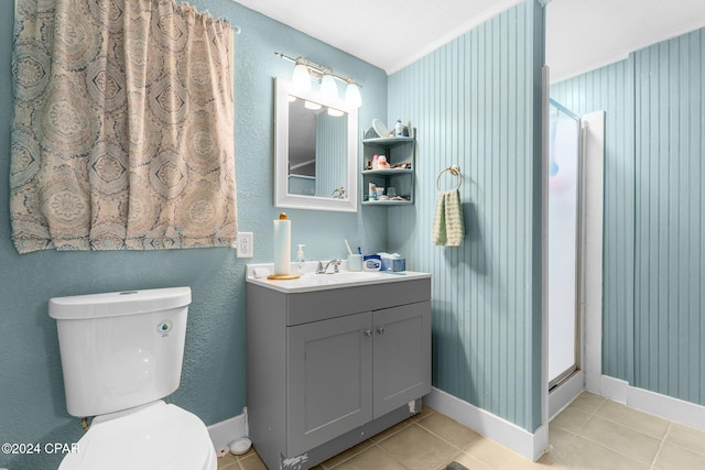 bathroom featuring toilet, vanity, and tile patterned floors