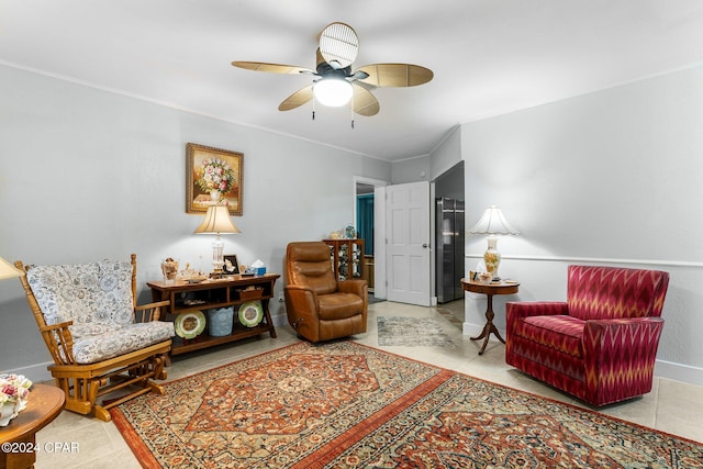 living area featuring light tile patterned floors and ceiling fan