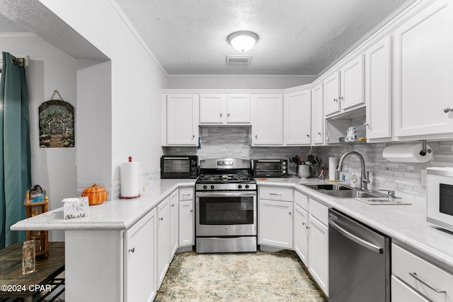 kitchen featuring white cabinets, sink, a textured ceiling, kitchen peninsula, and stainless steel appliances