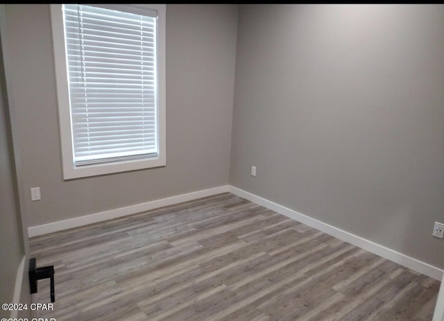 empty room with light hardwood / wood-style floors