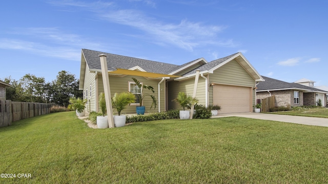 view of front facade featuring a garage and a front lawn