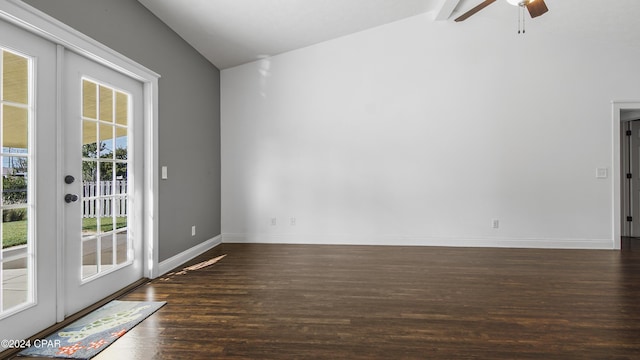 empty room featuring dark hardwood / wood-style flooring, lofted ceiling with beams, french doors, and ceiling fan