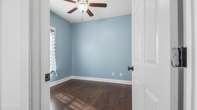 unfurnished room with ceiling fan and dark hardwood / wood-style floors