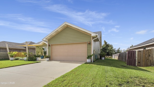 view of front of property featuring a garage and a front lawn