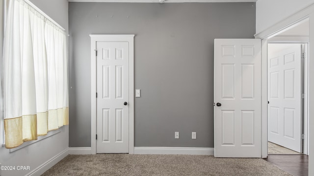 unfurnished bedroom with carpet