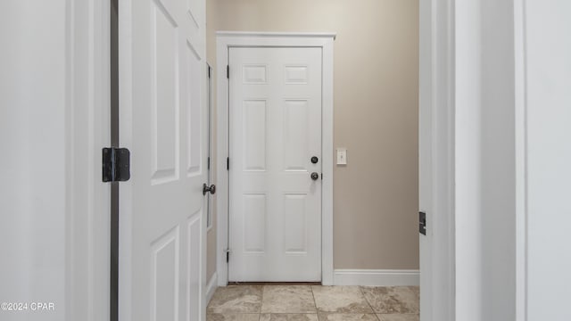 doorway featuring light tile patterned floors