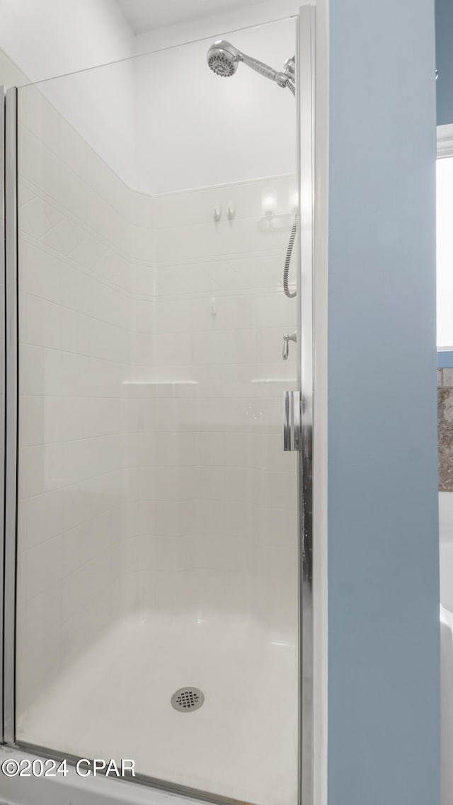 bathroom featuring an enclosed shower