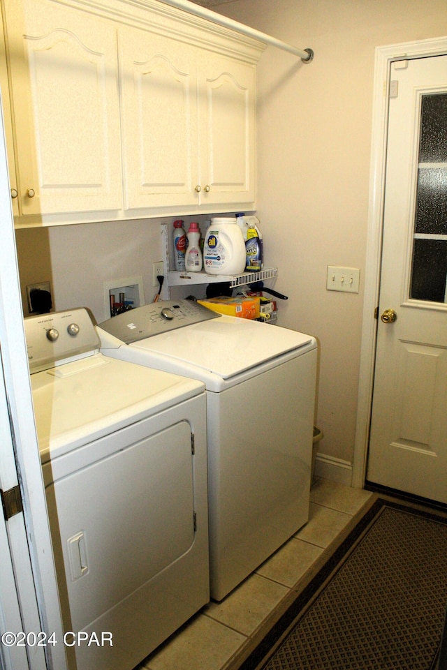 laundry room with cabinets and separate washer and dryer