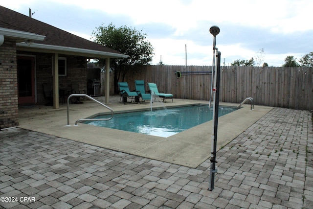 view of pool featuring a patio