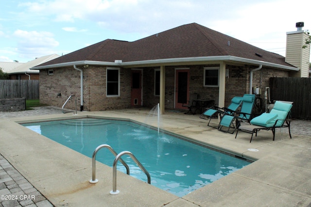 view of pool featuring a patio area and pool water feature