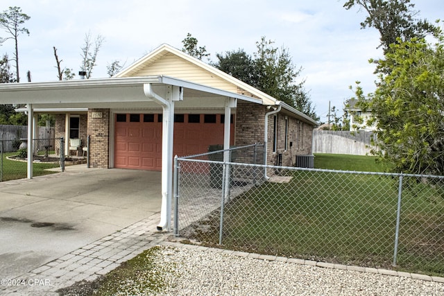 view of side of home featuring a yard and a garage