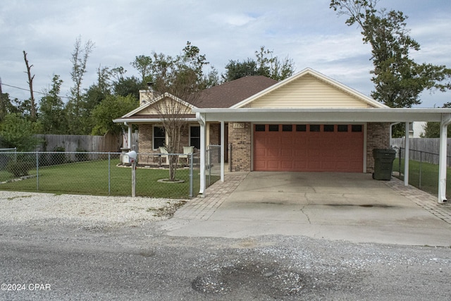 view of front of property featuring a front yard and a garage