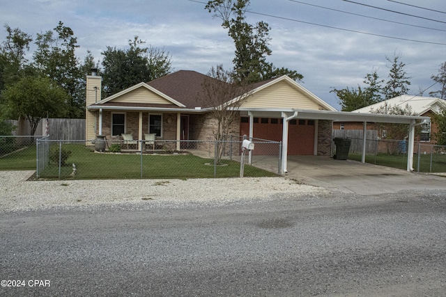 view of front of house with covered porch, a front yard, and a carport