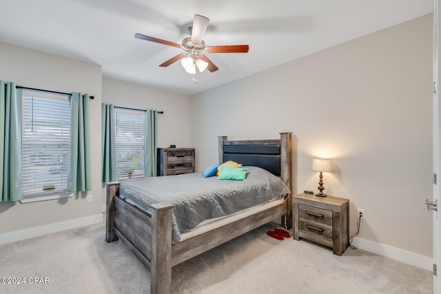 carpeted bedroom featuring ceiling fan