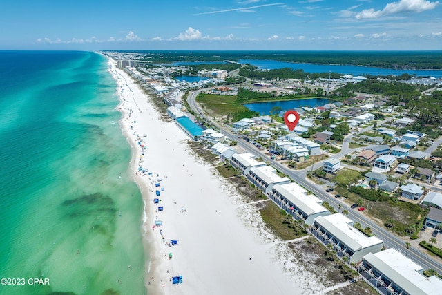 bird's eye view with a water view and a view of the beach