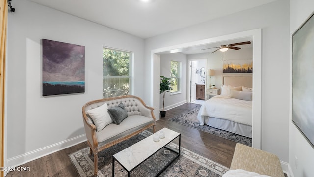 bedroom featuring ceiling fan and dark wood-type flooring