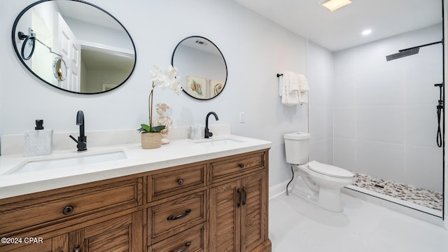 bathroom with walk in shower, vanity, and toilet