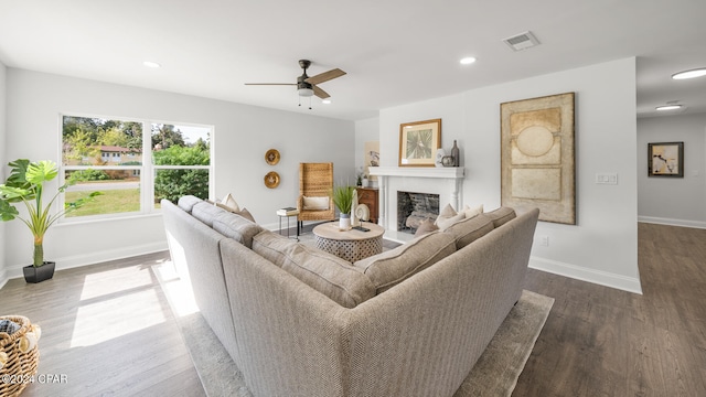 living room with hardwood / wood-style flooring and ceiling fan