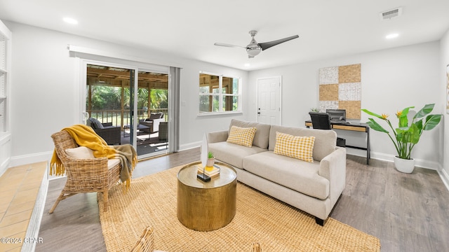 living room with hardwood / wood-style floors and ceiling fan