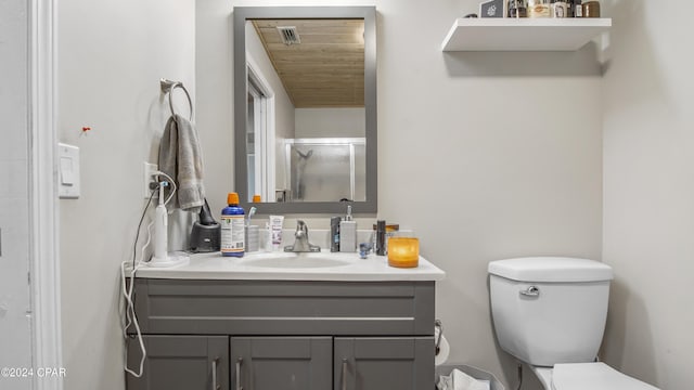 bathroom featuring wood ceiling, an enclosed shower, vanity, and toilet