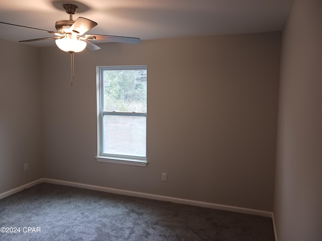 empty room featuring ceiling fan and carpet floors