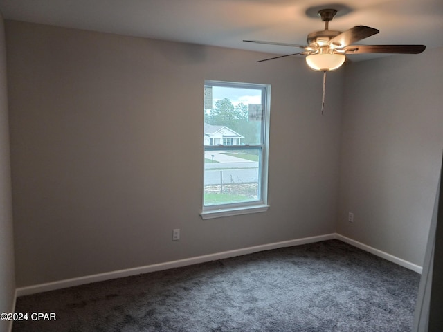 spare room featuring carpet flooring and ceiling fan