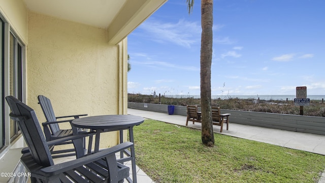 view of yard featuring a water view and a patio area