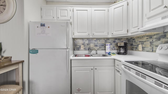 kitchen with white appliances, ventilation hood, sink, tasteful backsplash, and white cabinetry