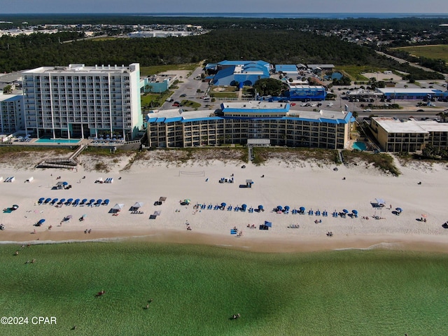 birds eye view of property with a beach view and a water view