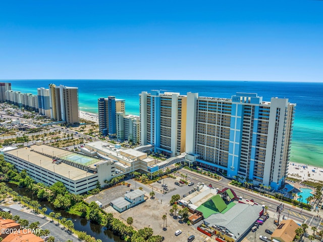 bird's eye view with a water view and a beach view