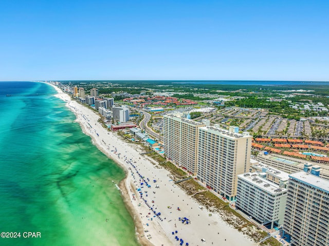 birds eye view of property featuring a water view and a view of the beach