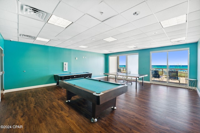 rec room with a paneled ceiling, wood-type flooring, and billiards