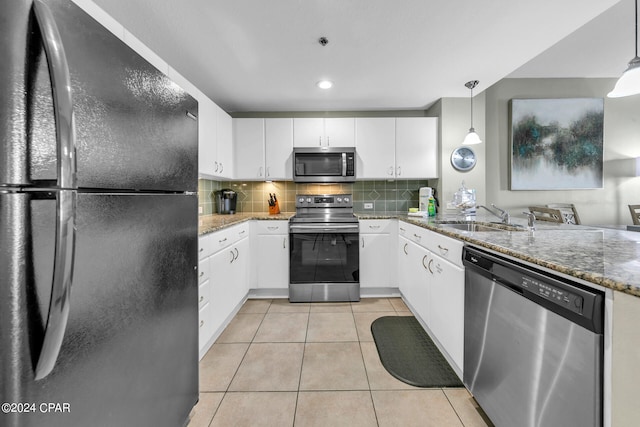 kitchen featuring pendant lighting, sink, white cabinetry, and stainless steel appliances