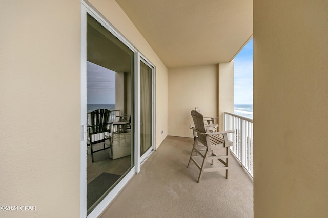 balcony featuring a water view