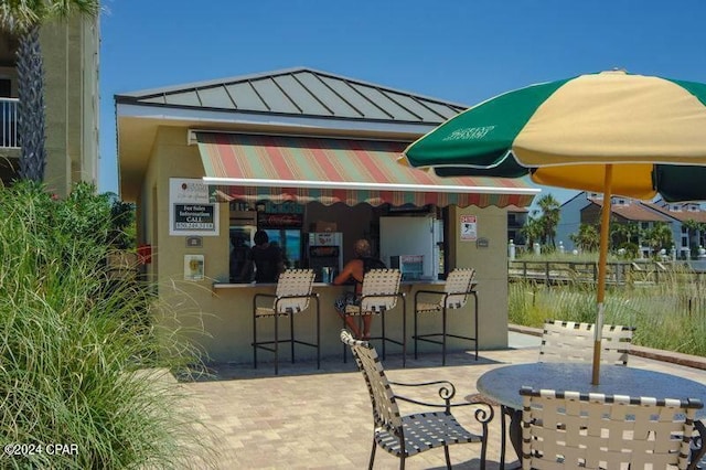 view of patio / terrace with exterior bar