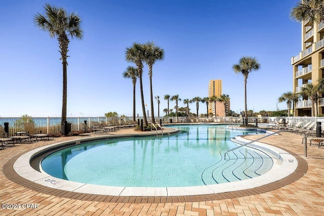 view of swimming pool with a patio area