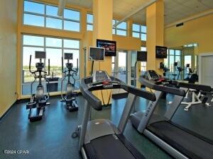 exercise room with a towering ceiling