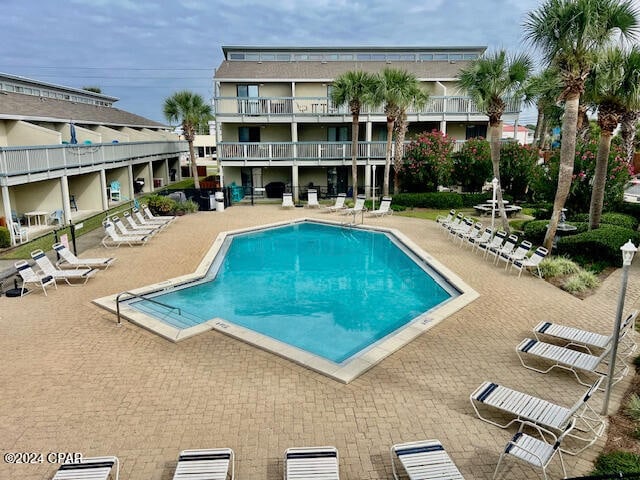 view of swimming pool featuring a patio area