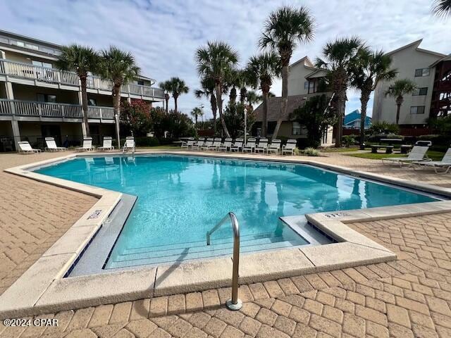 view of swimming pool with a patio area