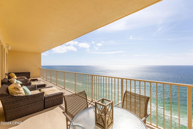 balcony with a beach view and a water view