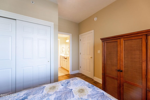 bedroom featuring light hardwood / wood-style flooring and a closet